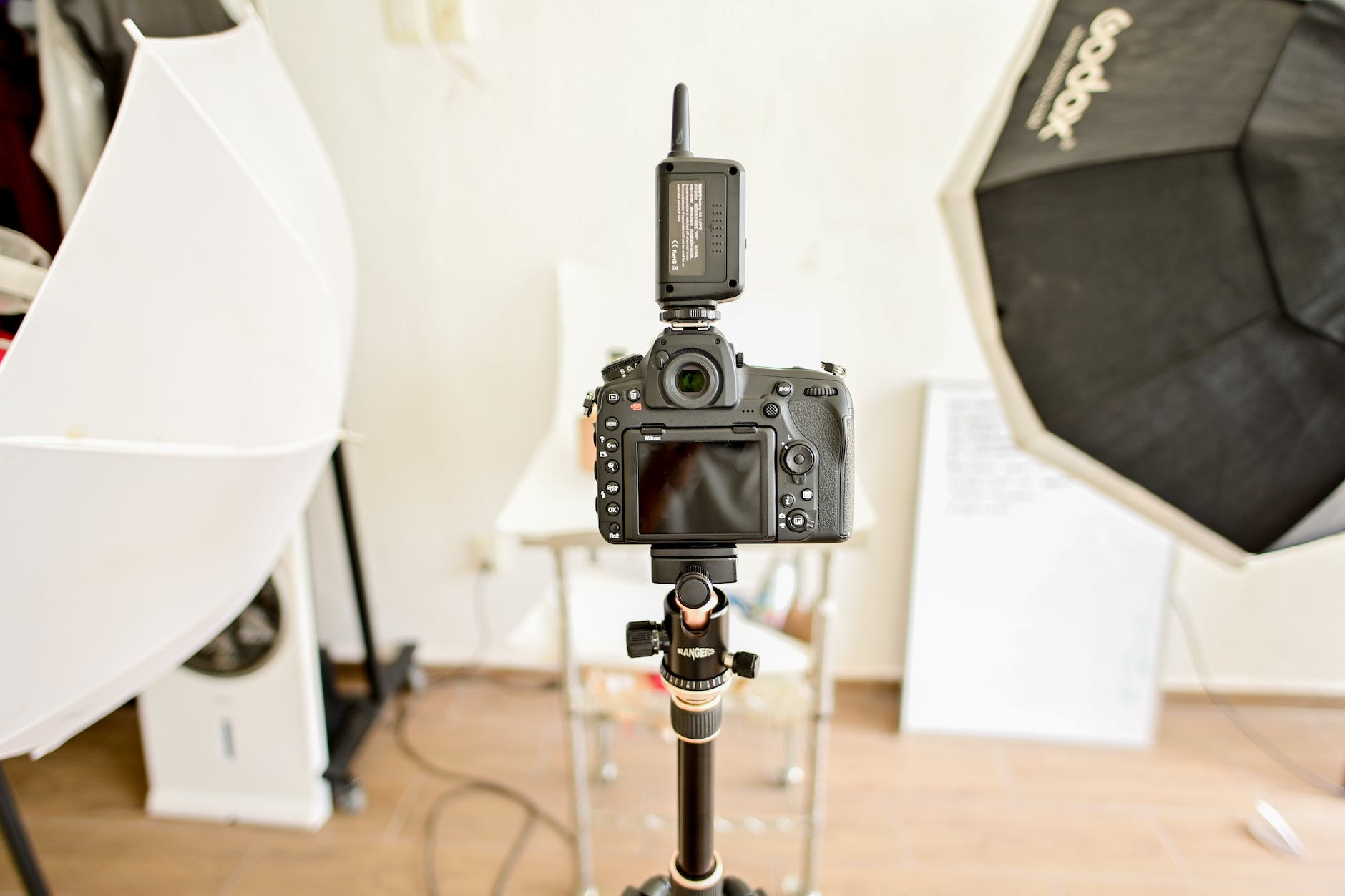 black digital camera set on a tripod